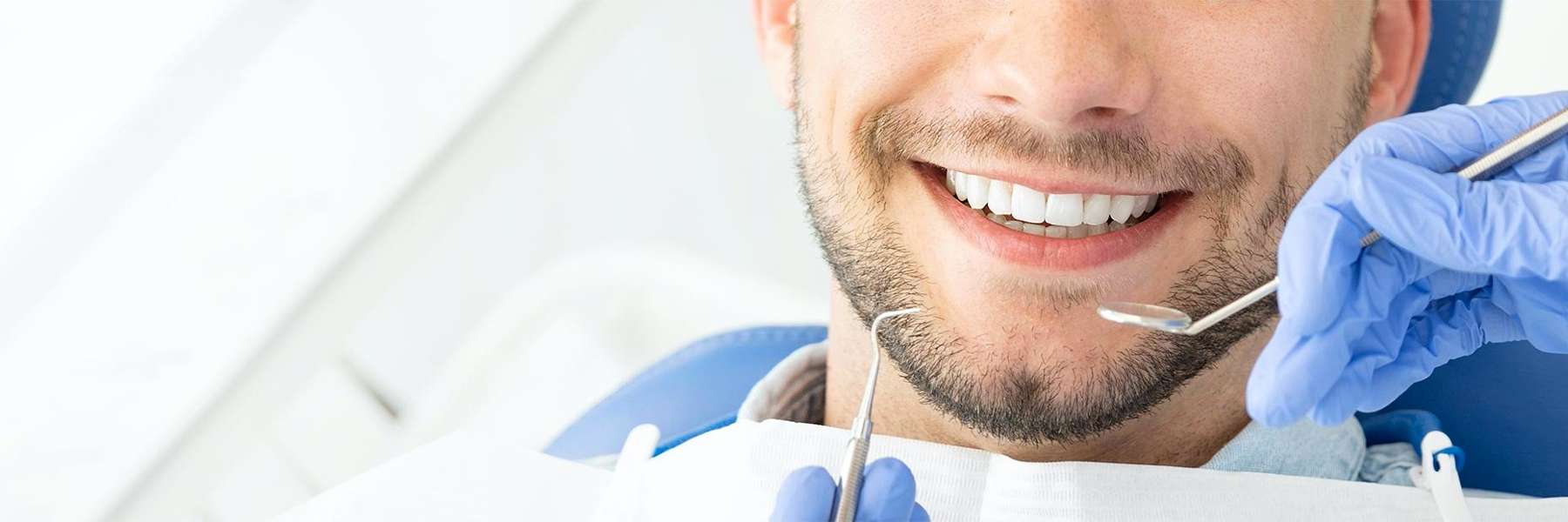 Man receiving a dental exam | Anthony Bartels DDS