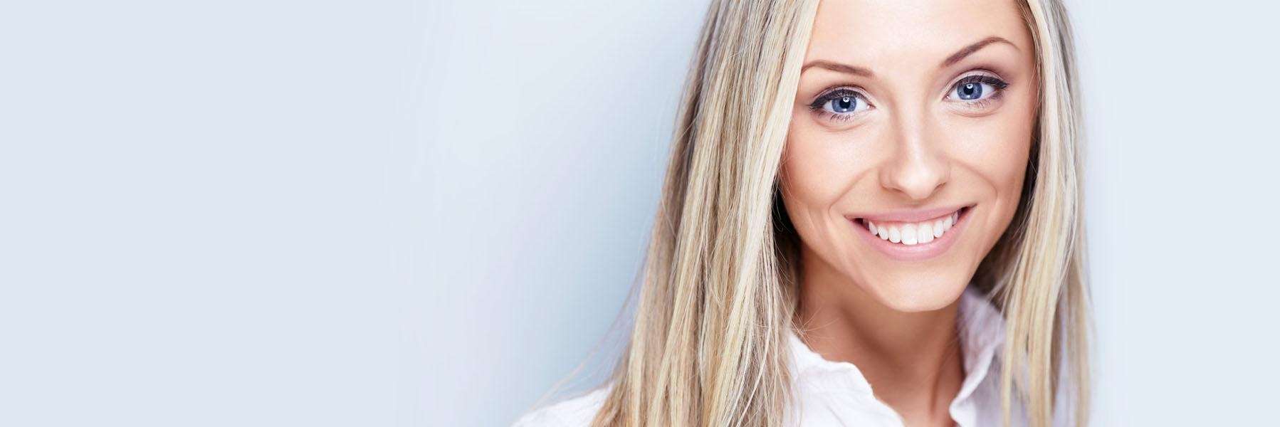 Woman smiling | dental benefits Anthony Bartels DDS