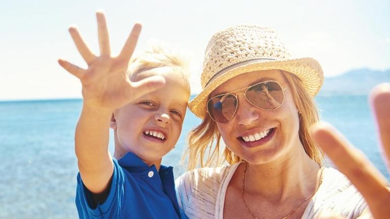 mother and son on beach | Jonesboro dentist