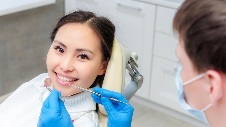 Woman smiling with dental crowns in jonesboro ar