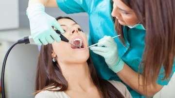 Woman getting a dental cleaning | Jonesboro Dentist