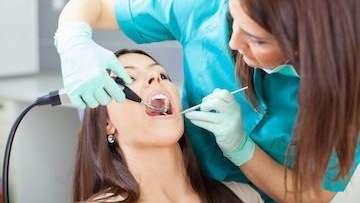 Woman getting a dental cleaning