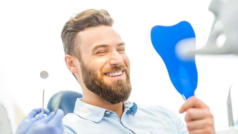 man smiling at jonesboro dentist