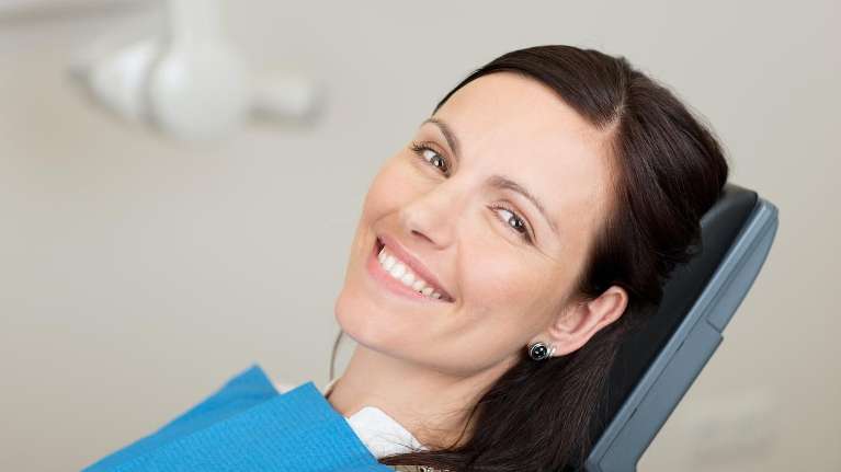 A woman sitting in the dental operating room | dentist Jonesboro