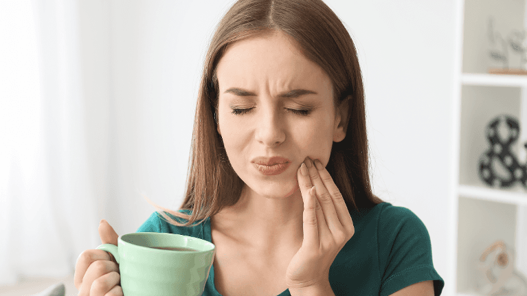 Woman with a toothache | best Jonesboro dentist