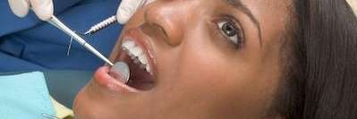 woman getting an oral exam