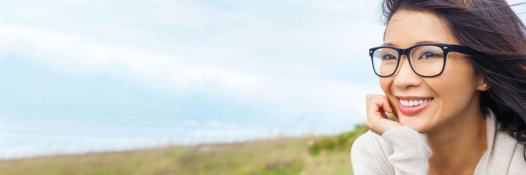 woman outside smiling | dental cleaning