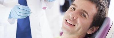 Man smiling during a dental exam