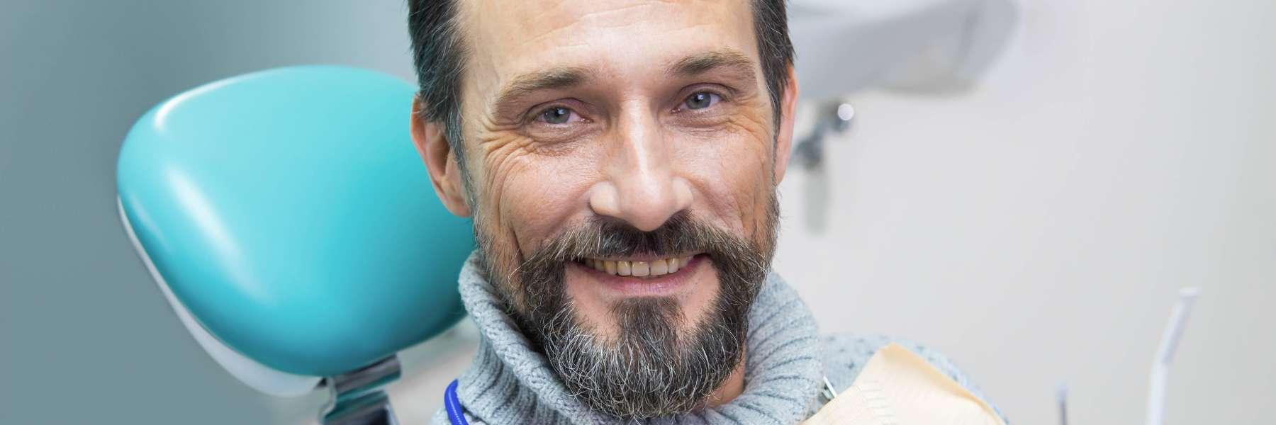 Man smiling in dentist's chair